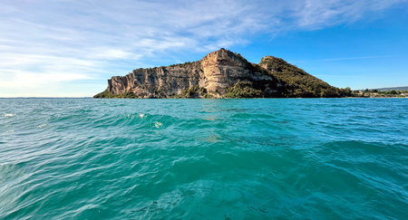 A motorboat trip across Lake Garda along the Sirmione peninsula on the southern shore of Lake Garda in northern Italy.の写真素材