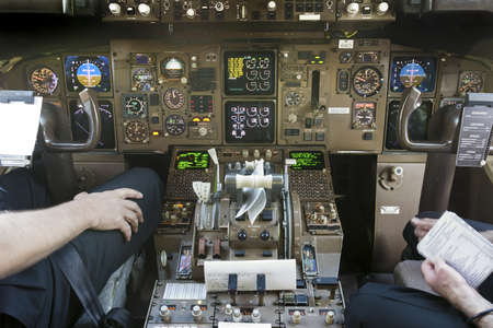 Captain and Co Pilot in Cockpit preparing for Take Offのeditorial素材