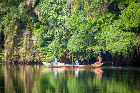 Traditional Boats on Tropical River Volta in Ghana, West Africa.