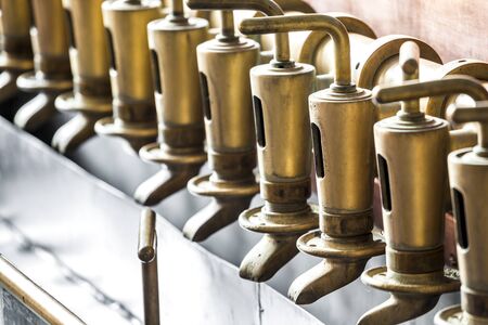 Copper tap in beer brewery buildingの写真素材