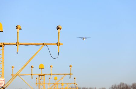 Airplane is landing using airport's navigation system