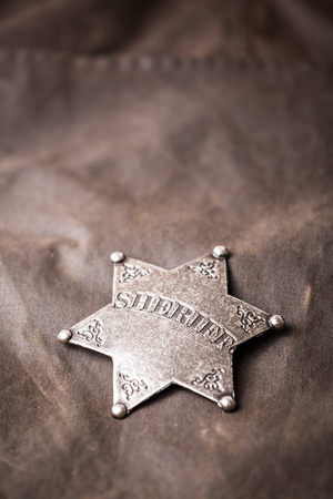 Close up of sheriff badge when on his coat dusterの写真素材