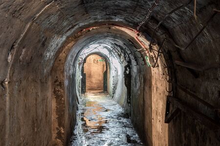 Real underground post mine illuminated tunnel .の写真素材