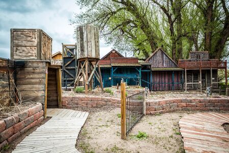 Small old town with wooden colorful buildings and entrance to a mineのeditorial素材