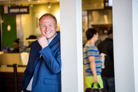 Businessman portrait in restaurant area at the airport