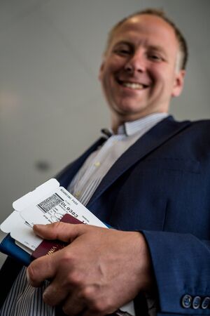 Man with boarding pass and passport at the airport