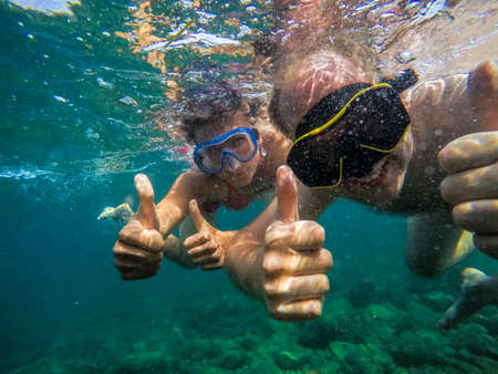 Couple swimming underwater in Adriatic Sea