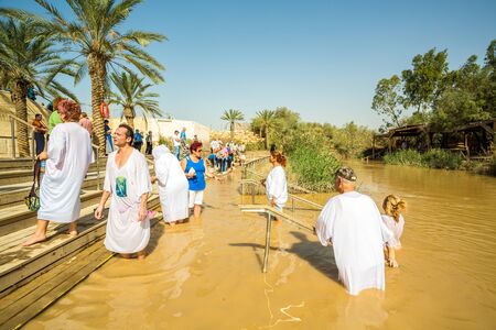 Jericho, Israel - November 2, 2015: Organized baptism for group of pilgrims in river of Jordan, the place which is believed that Jesus was baptizedのeditorial素材