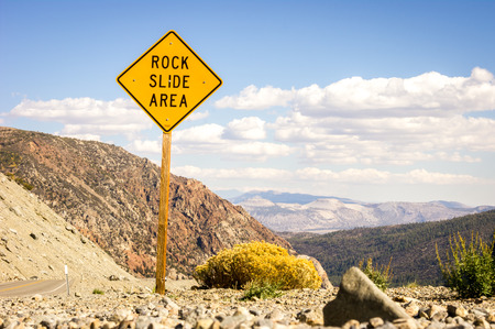 Road warning sign informing about rock slide area, USAの写真素材
