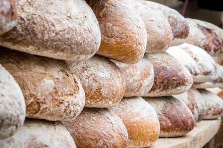 Many delicious loafs of bread in a bakeryの写真素材