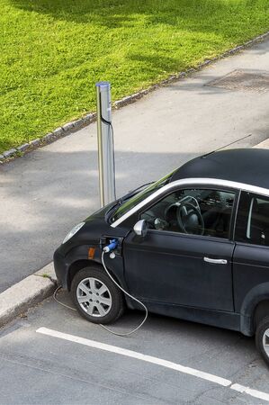 Electric car charging battery at the stationの写真素材