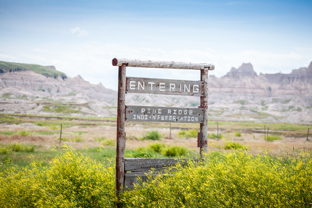 Entering Pine Ridge Indian Reservation Road Sign, South Dakota, USAの写真素材