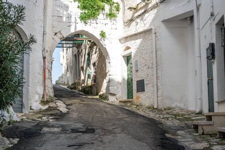 Narrow street in romantic white city of Ostuni, Puglia, Italyの写真素材