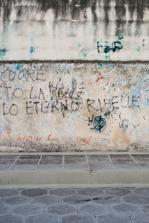 Graffiti about rebellion on italian wall, Lecce, Puglia.の写真素材