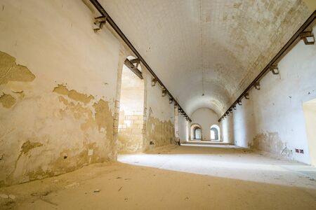 Long corridor in abandoned fortress, Brindisi, Italyの写真素材