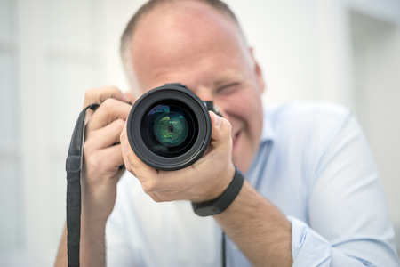 Portrait of the photographer outdoor in urban scenery