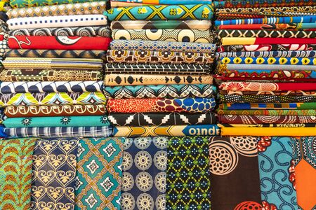 Plenty of colorful african fabrics on local open air market, Maputo, Mozambique