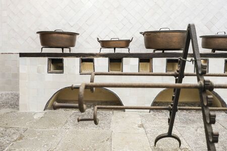 Copper utensils and piglet grate in original vintage kitchen, Sintra, Portugalの写真素材