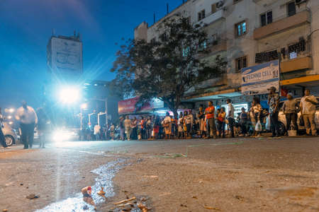Maputo, Mozambique - May 15, 2019: Many local people waiting for a bus in the capital city