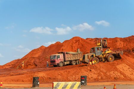 Road construction site with diggers and trucks, Maputo, Mozambiqueの写真素材