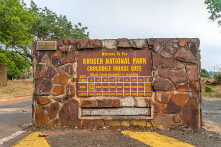 Kruger National Park, South Africa - May 17,2019: Crocodile Bridge Gate with opening hours to Kruger National Park, South Africaのeditorial素材