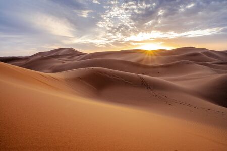 Beautiful sunset over sand dunes of Sahara Desert, Morocco, Africaの写真素材