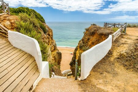 Spectacular walkway on the cliffs by Praia Nova what means New Beach in Porches, Algarve, Portugalの写真素材