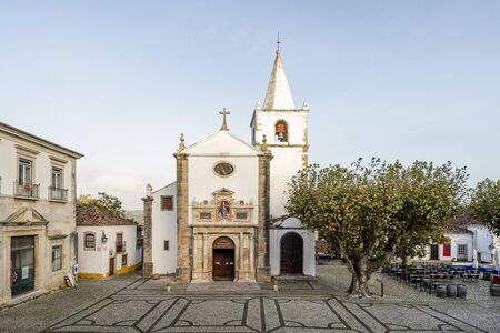 Historic church in city center of beautiful Obidos, Portugalの写真素材