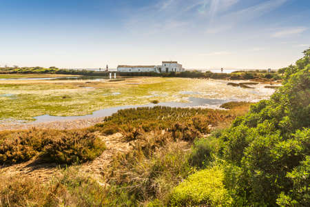 Tide mill building in Ria Formosa Natural Park Quinta do Marim, Olhao, Algarve, Portugalの写真素材