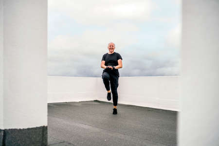 A man doing cardio exercises on the rooftop during lockdown, Portugal