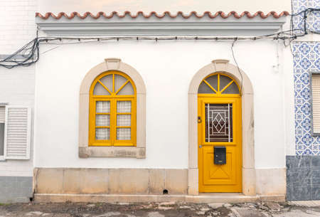 Cute, traditional Portuguese fisherman house in Olhao, Algarve, Portugalの写真素材