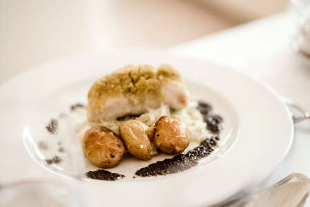 Traditional Portuguese meal made of baked cod served with baked potato