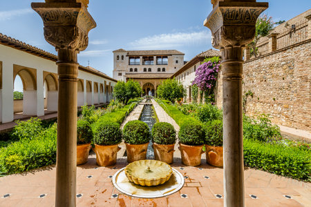 Generalife Moorish palace with green courtyard in Alhambra, Granada, Spainのeditorial素材