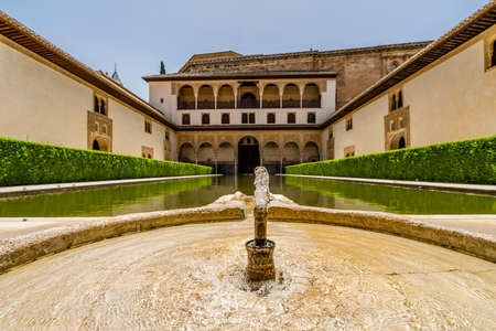 Courtyard with pond in Nasrid palaces in Alhambra of Granada, Andalusia, Spainのeditorial素材