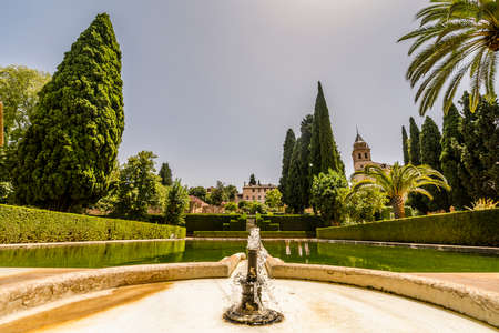 Garden with fountain and pond in Arabic palace complex called Alhambra in Granada, Spainのeditorial素材