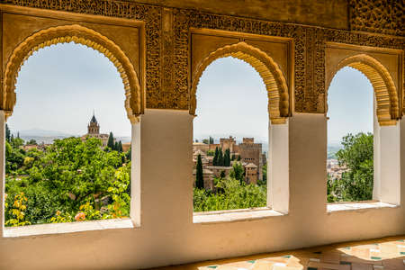 View of Nasrid Palaces through Arches of Generalife Palace in Alhambra in Granada, Spainのeditorial素材