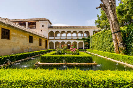 Generalife Moorish palace with green courtyard in Alhambra, Granada, Spainのeditorial素材