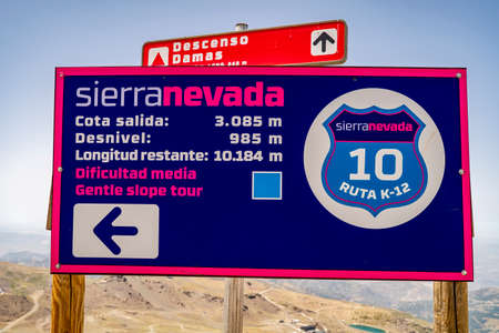Sierra Nevada, Spain - July 17, 2021: Information sign about route high in Sierra Nevada mountains