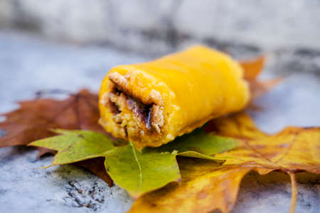 Delicious typical sweet desert called Torta de Azeitao on autumn leaves, Azeitao, Portugal