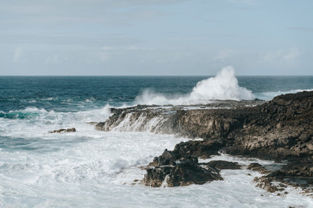 Water splash on black volcanic rocks of Tenesar, Lanzarote, Canary Islands, Spainの写真素材