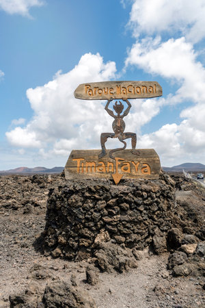 Timanfaya National Park sign on volcanic black rocks in Lanzarote, Canary Islands, Spainの写真素材