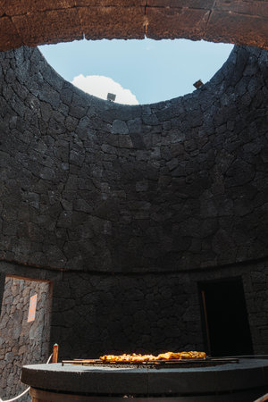 Tasty meat barbecued on volcanic heat, Timanfaya National Park, Canary Islands, Spainの写真素材