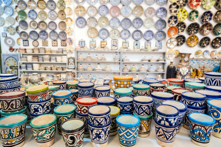Shelves full of handmade ceramic products in pottery factory in Fez, Morocco, North Africa