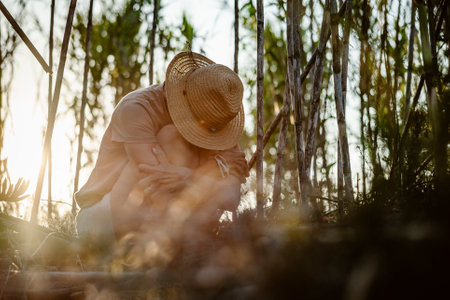 Woman with her head down in forest