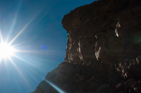Large volcanic formation in the backlight of the evening sun
