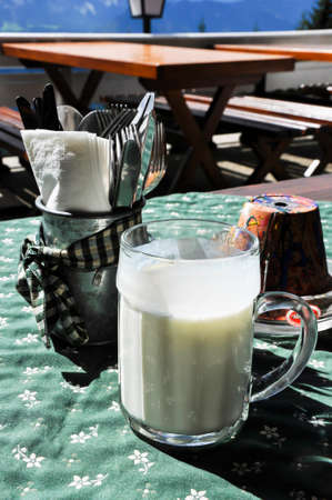 Snack on an alpine pasture, the buttermilk is already served in a large jug,の写真素材
