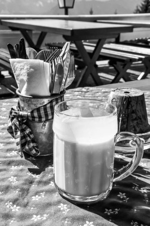 Snack on an alpine pasture, the buttermilk is already served in a large jug,の写真素材