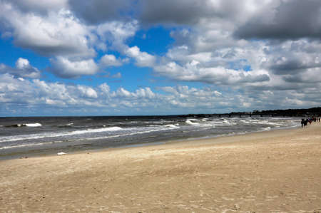 Wide Baltic Sea beach in Poland near Kolobrzeg. Beautiful late summer evening on the deserted beach