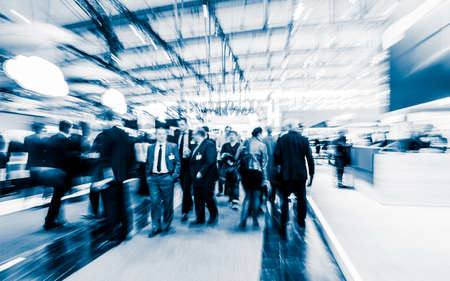 blurred people at a trade fair hallの写真素材