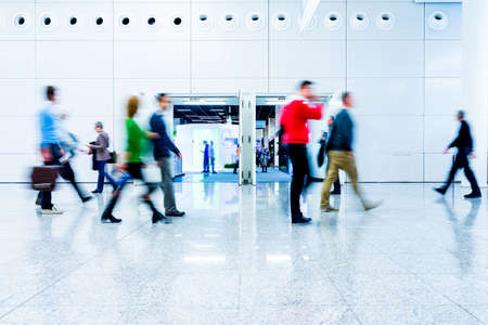 blurred people at a trade fair hallの写真素材